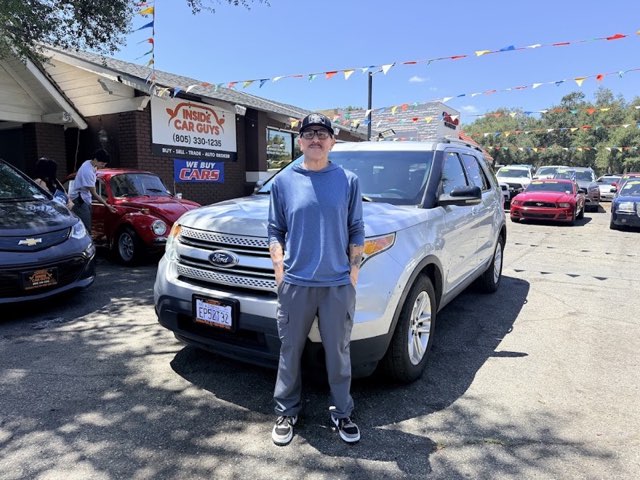 Inside Car Guys customer with their new car