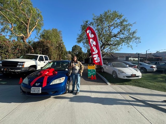 Inside Car Guys customer with their new car