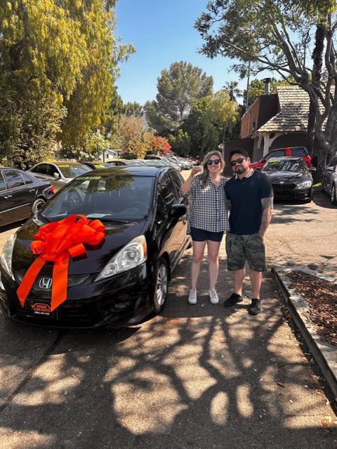 Inside Car Guys customer with their new car