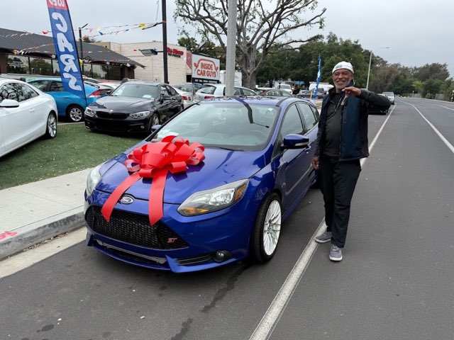 Inside Car Guys customer with their new car