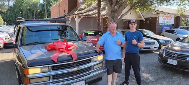 Inside Car Guys customer with their new car